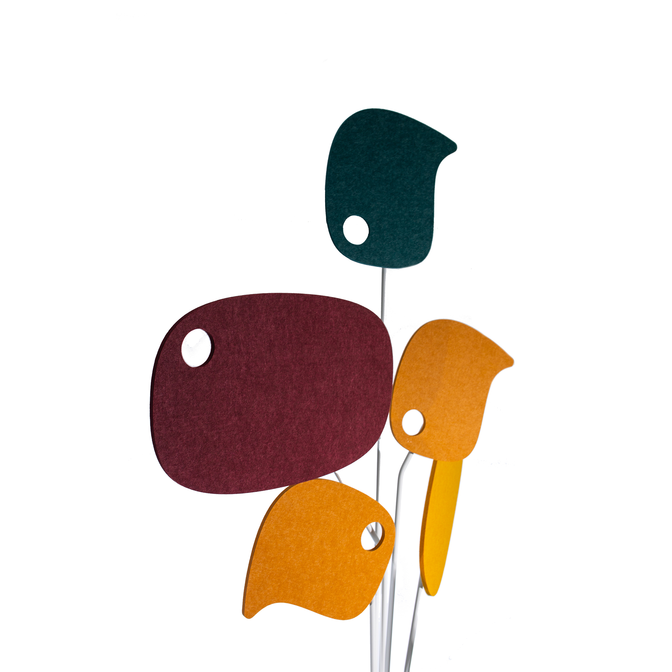 A modern sculpture with white metal stems and colorful, abstract leaf shapes in red, orange, yellow, blue, and green. It conveys a playful, artistic tone.