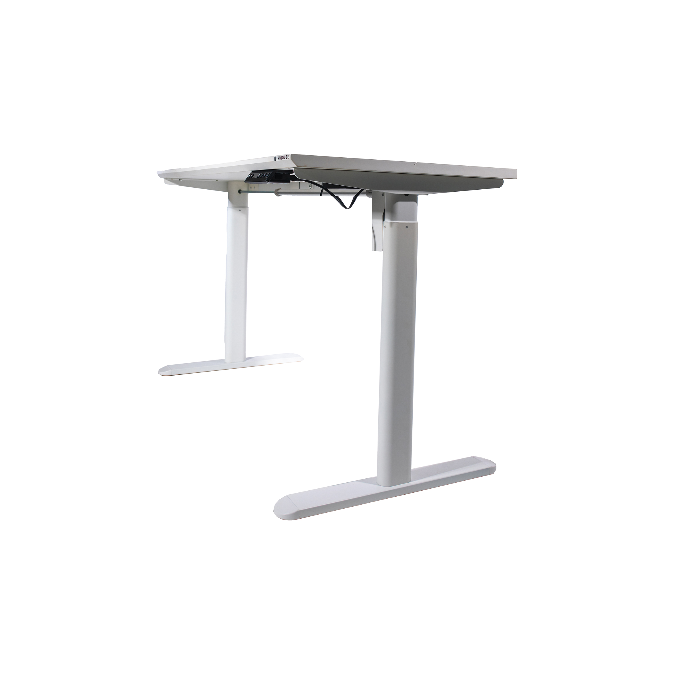 A white adjustable standing desk with a sleek, minimalist design. Two black cords hang from the underside, and the desk stands on T-shaped legs.