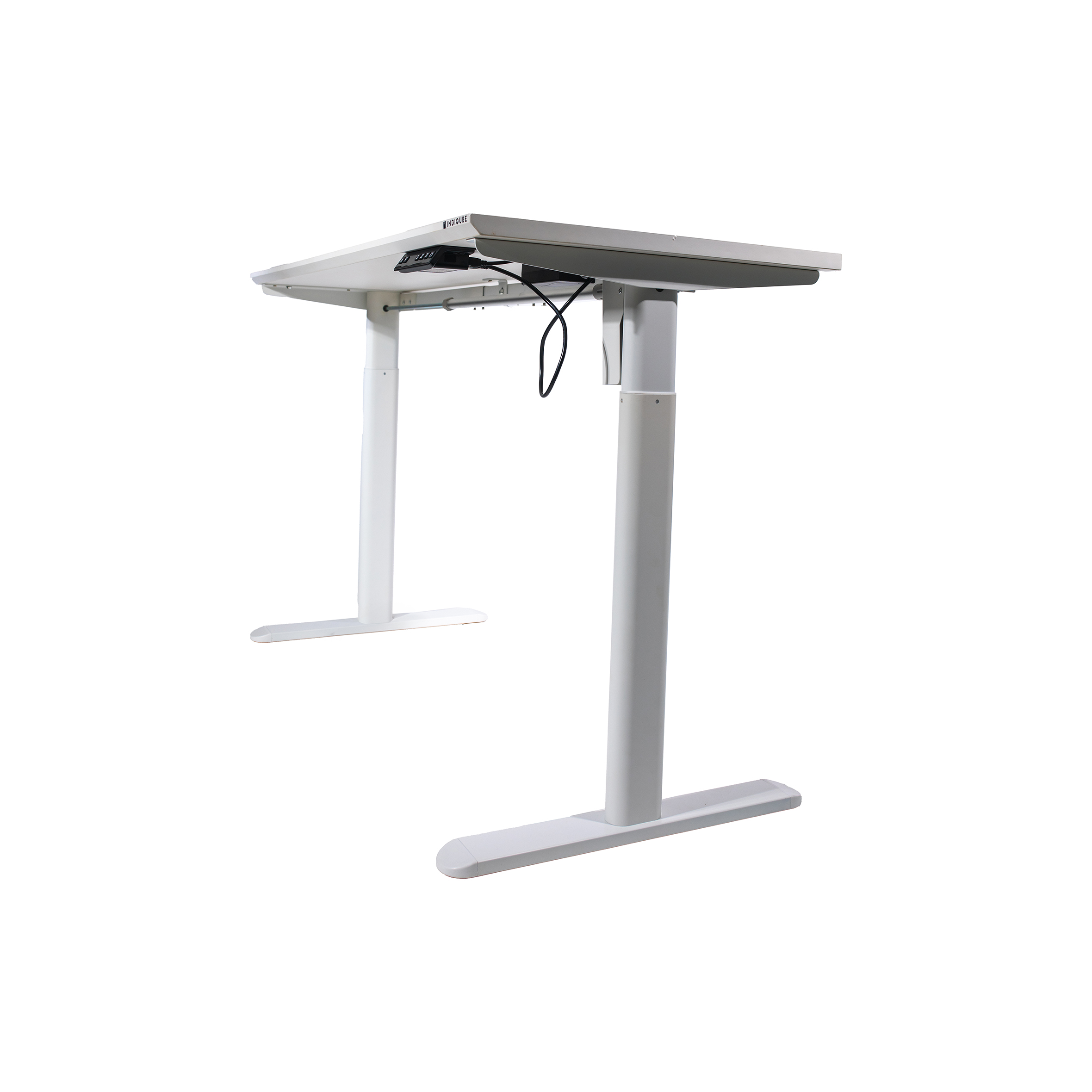 A white adjustable standing desk with a sleek, minimalist design. Two black cords hang from the underside, and the desk stands on T-shaped legs.