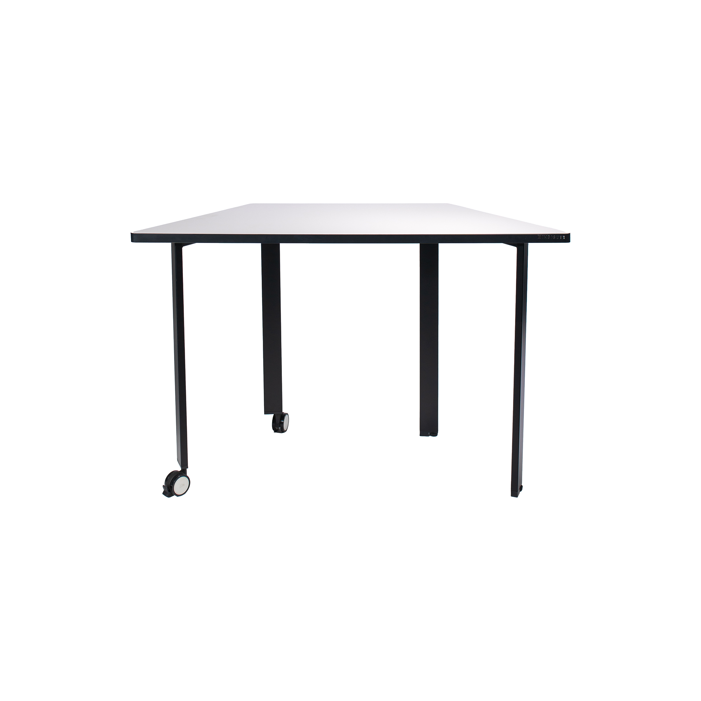 Minimalist trapezoidal table with a white top and four black legs. Two legs have wheels, suggesting mobility. Clean, modern design, suited for versatile use.