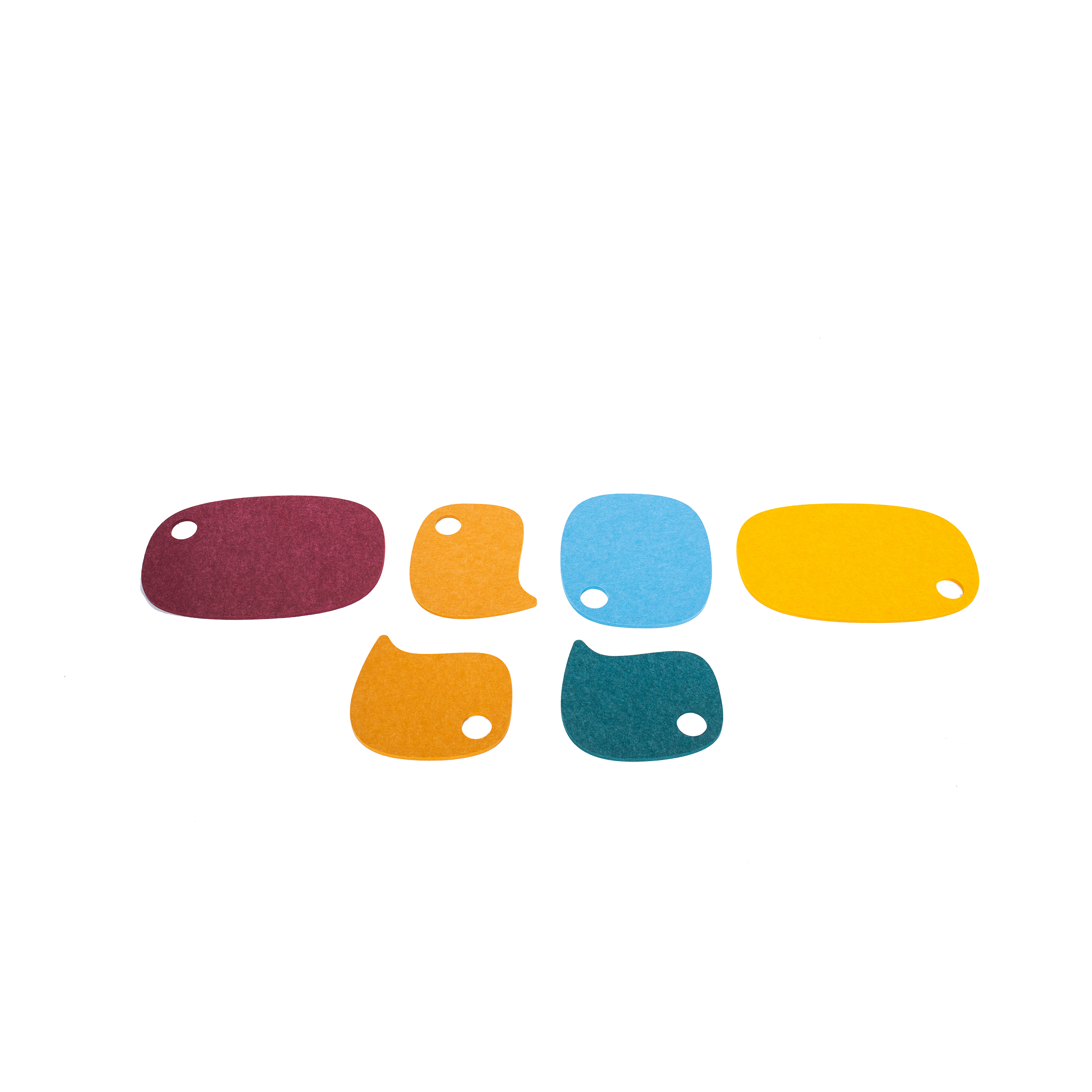 A modern sculpture with white metal stems and colorful, abstract leaf shapes in red, orange, yellow, blue, and green. It conveys a playful, artistic tone.
