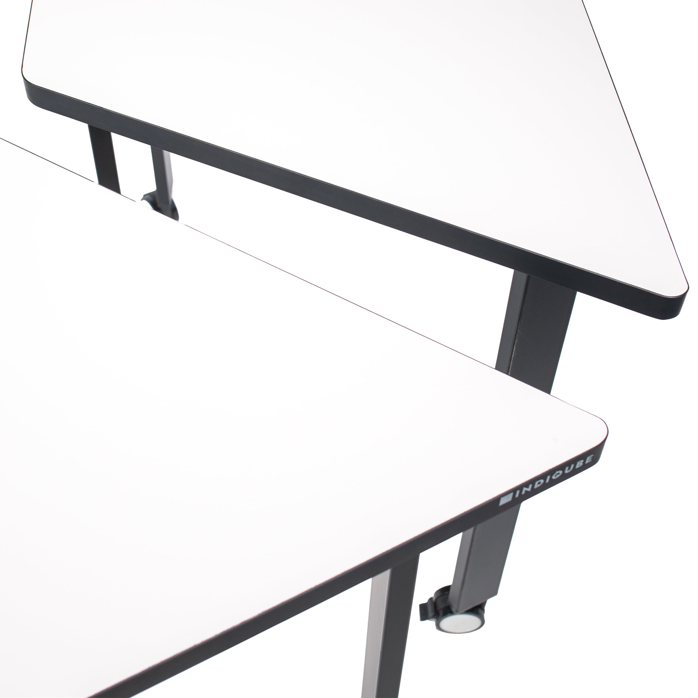 Minimalist trapezoidal table with a white top and four black legs. Two legs have wheels, suggesting mobility. Clean, modern design, suited for versatile use.