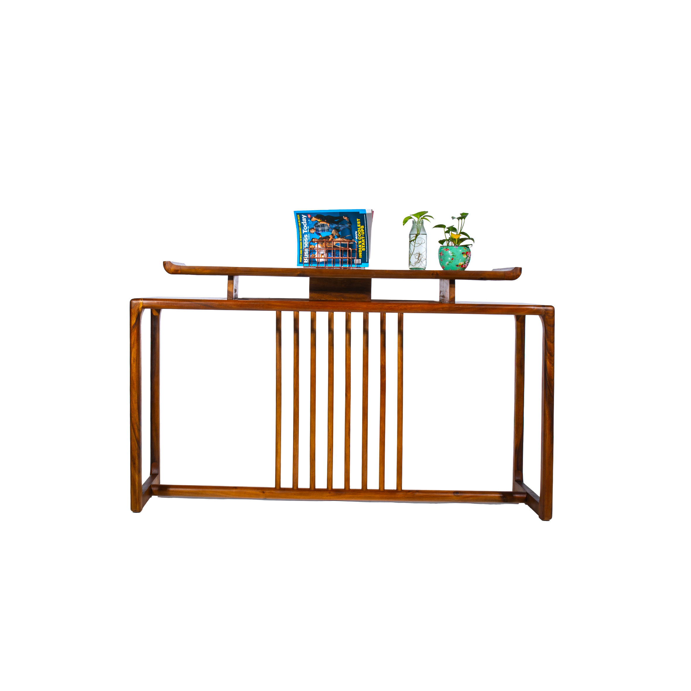 Elegant wooden table with vertical slats, featuring a book and two small potted plants on top, against a simple white background.