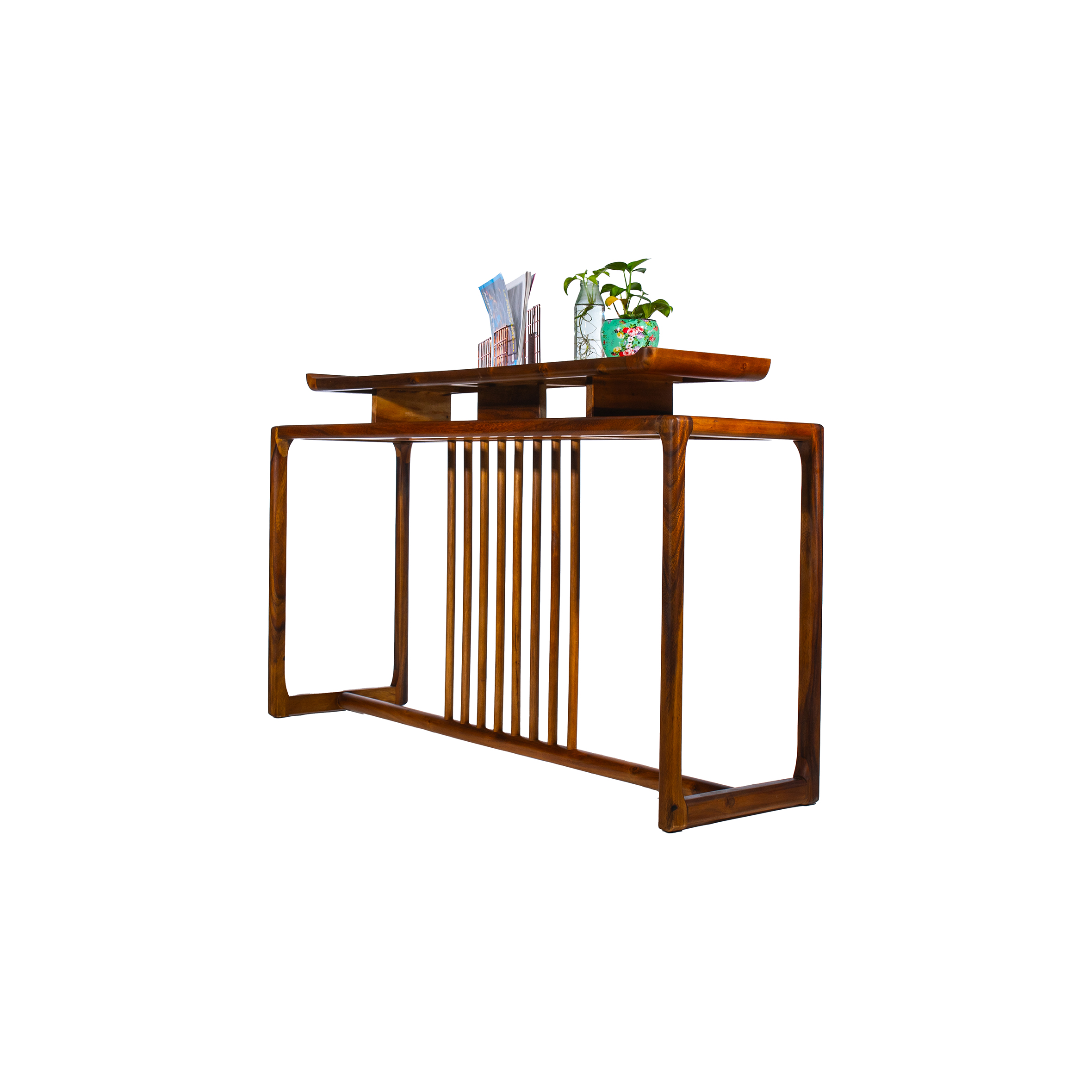 Elegant wooden table with vertical slats, featuring a book and two small potted plants on top, against a simple white background.