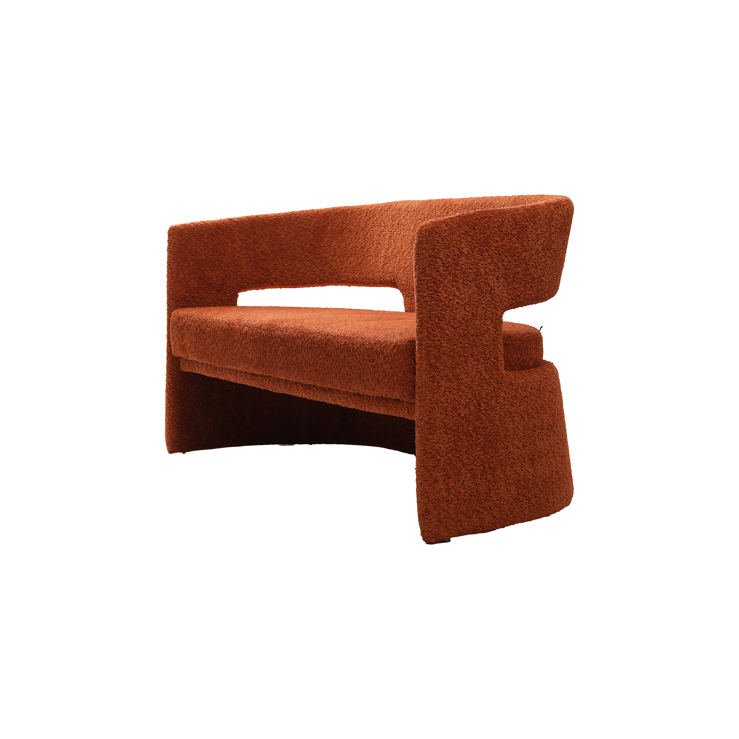 Modern curved rust-colored sofa with a sleek, minimalistic design and plush texture. The sofa's geometric cutouts add a contemporary and cozy feel.