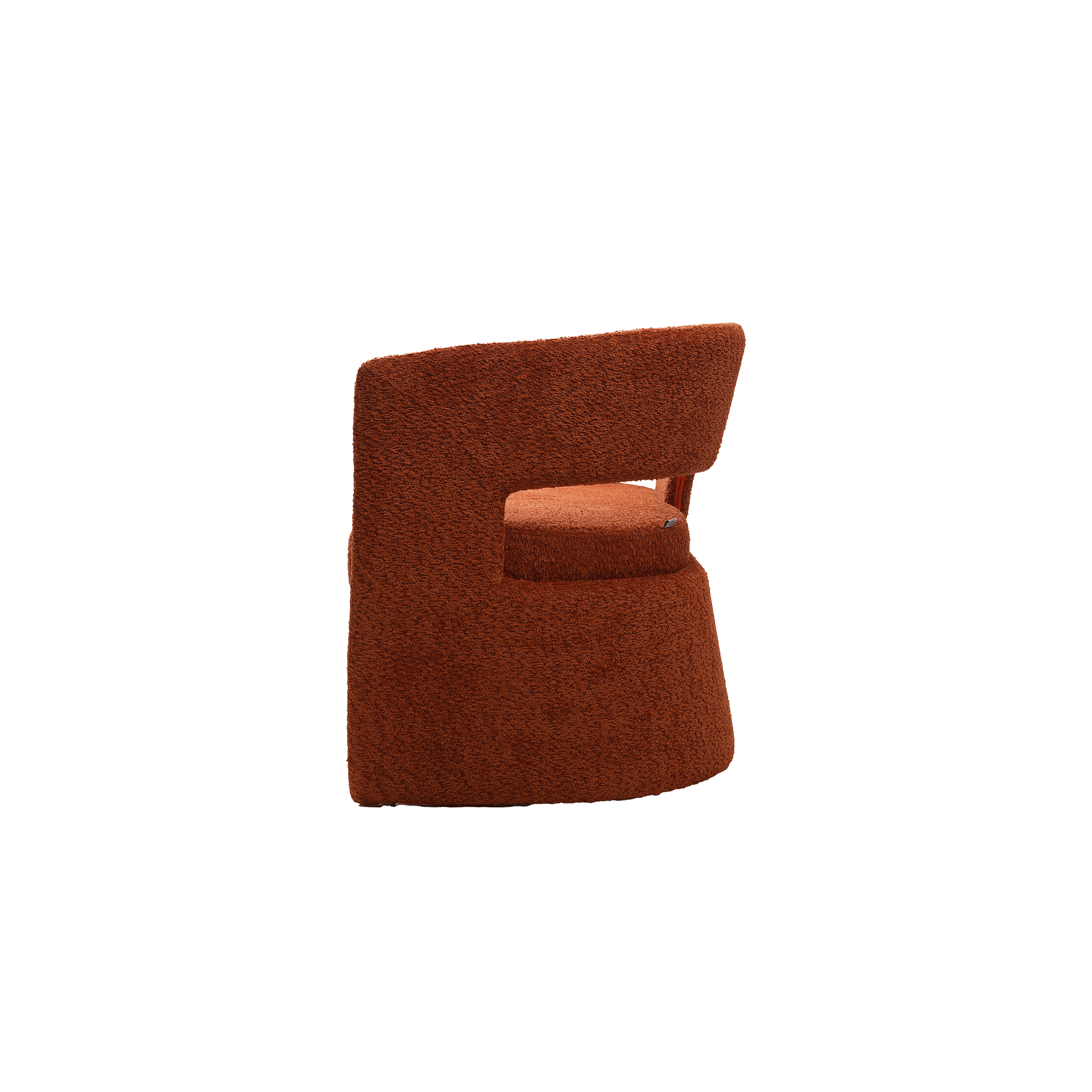 Modern curved rust-colored sofa with a sleek, minimalistic design and plush texture. The sofa's geometric cutouts add a contemporary and cozy feel.