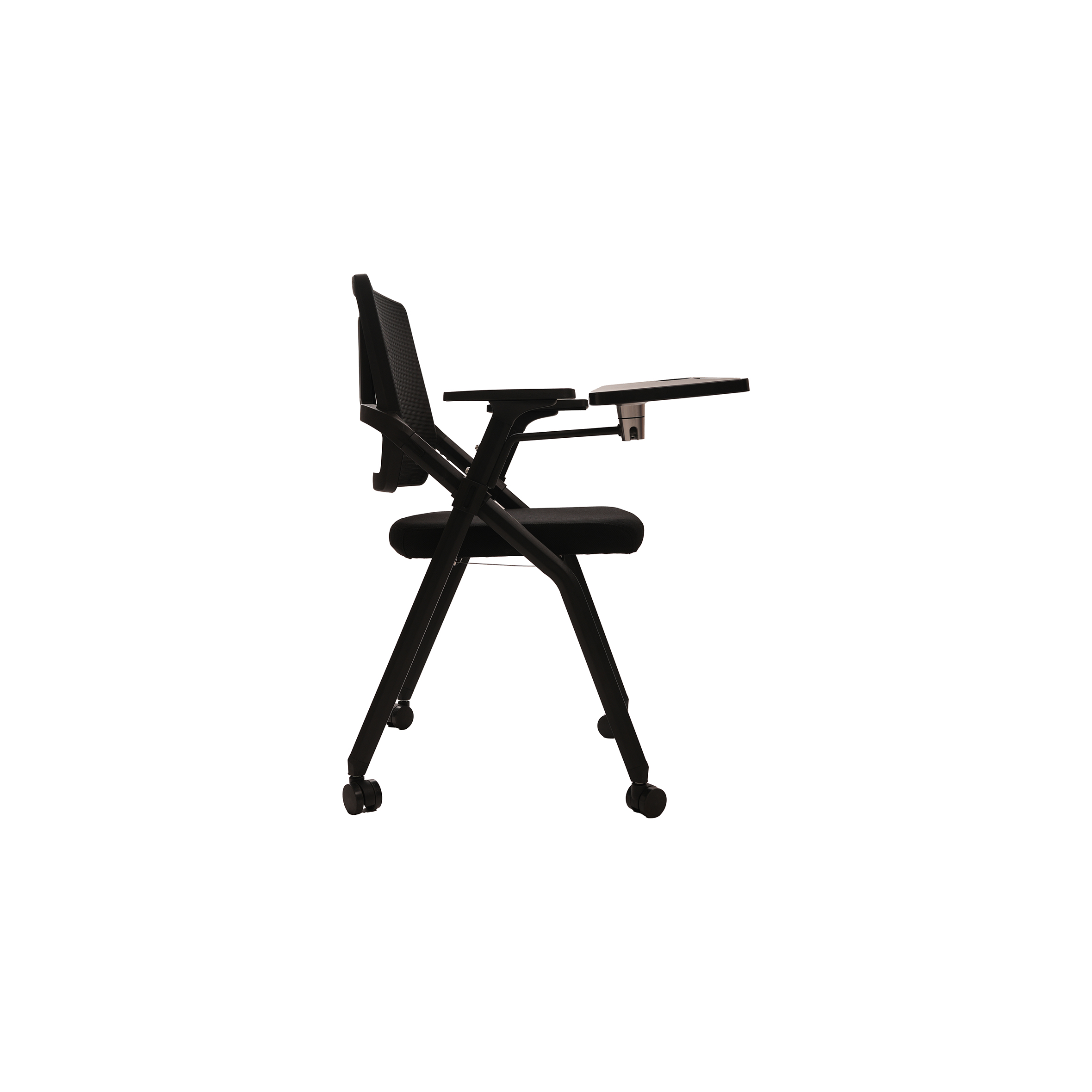 A black folding chair with wheels and a mesh backrest, featuring an attached foldable writing tablet on the left arm, set against a white background.