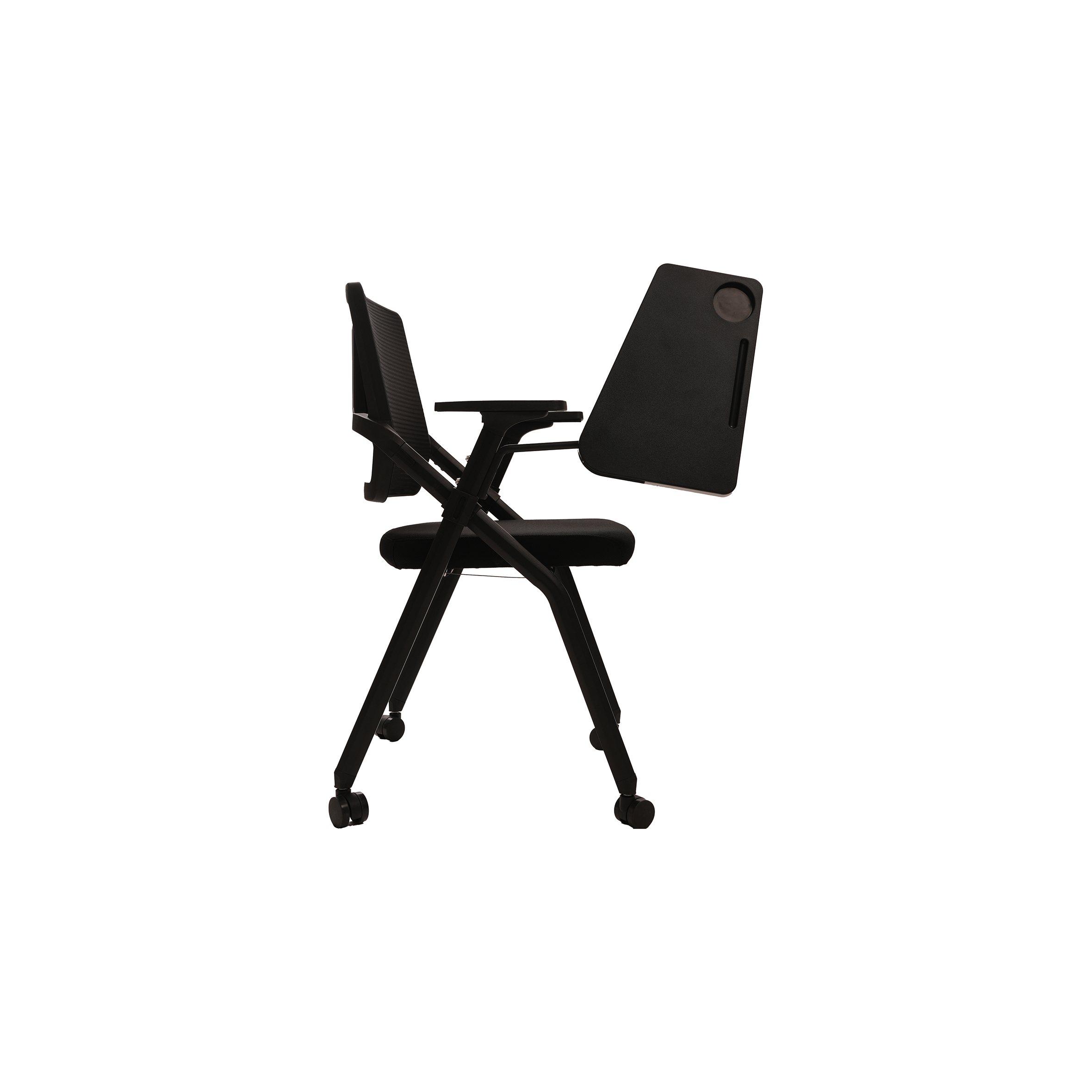 A black folding chair with wheels and a mesh backrest, featuring an attached foldable writing tablet on the left arm, set against a white background.