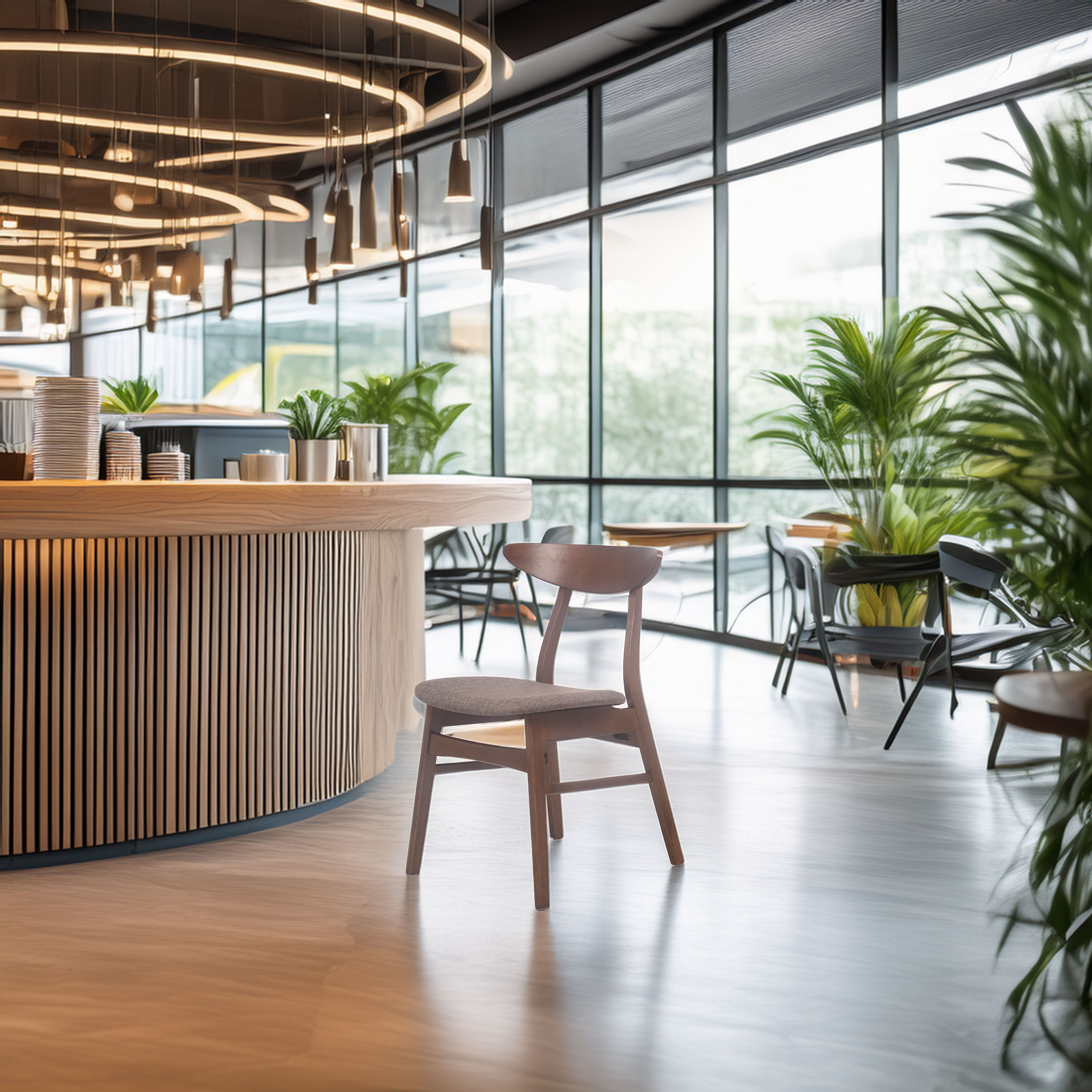 Modern café interior with a sleek, circular wooden counter, hanging pendant lights, and lush green plants near large windows, creating a cozy ambiance.
