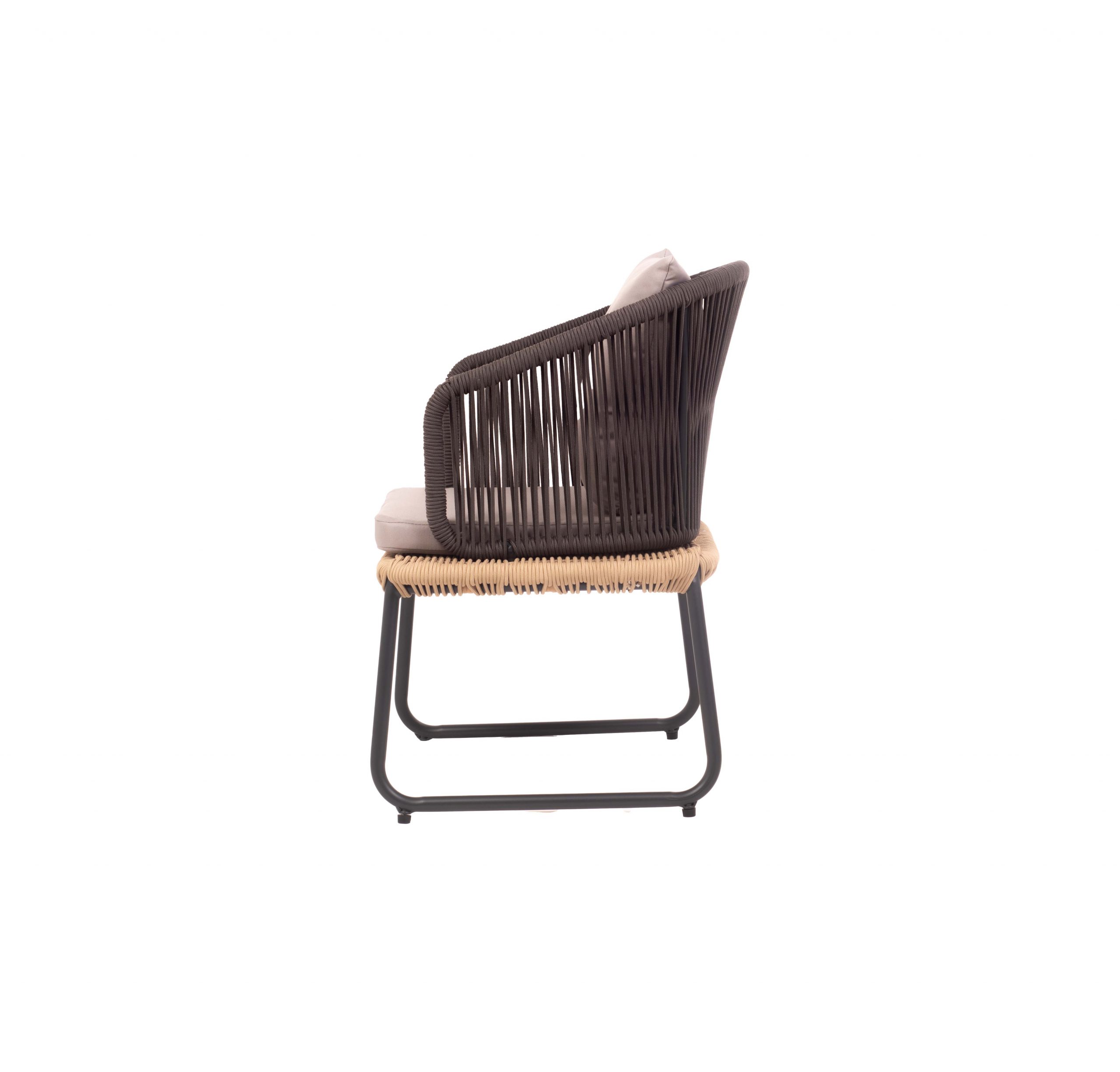 Modern chair with a woven black frame, light grey cushions, and slim black legs. The minimalistic design conveys a sense of comfort and elegance.