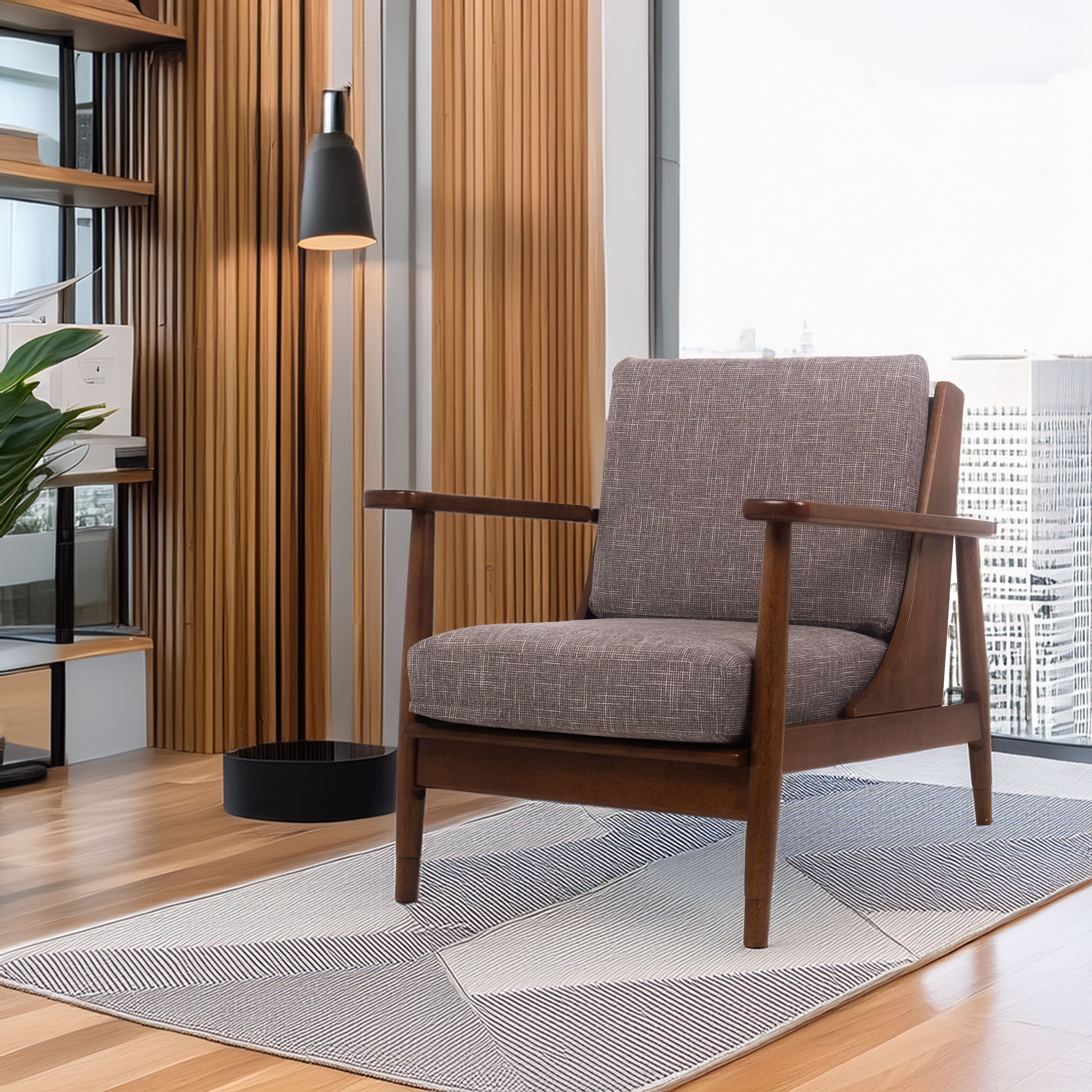 Mid-century modern chair with brown upholstery and wooden arms on a geometric rug. Tall lamp and potted plant add warmth to the bright room.